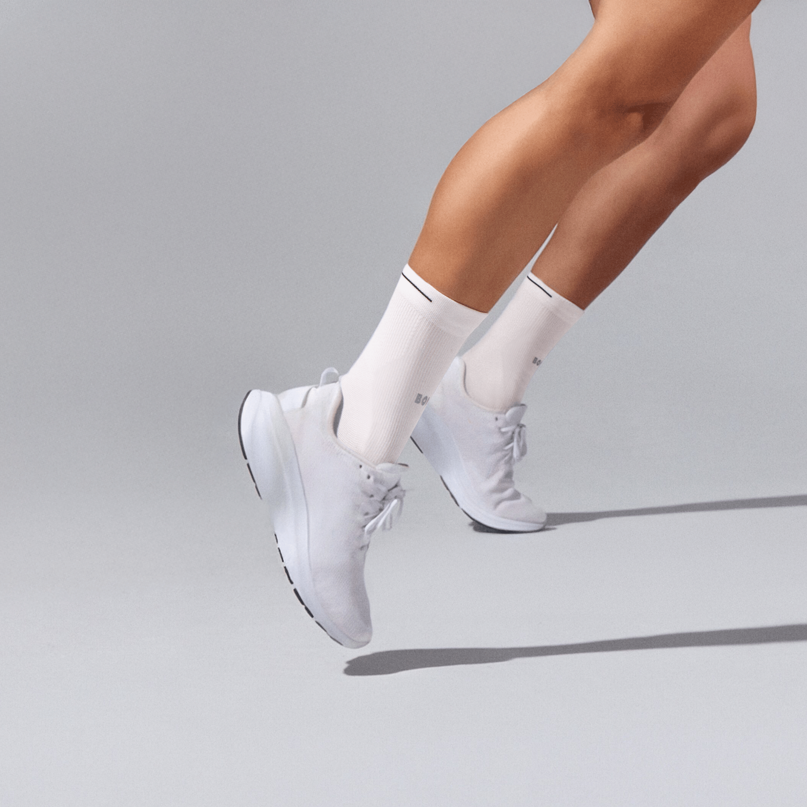 official-bombas::10885-white-adult-unisex-onmodel-0-transparent__1_.png